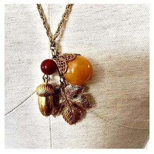 Carnelian gold tone acorn leaf charm necklace